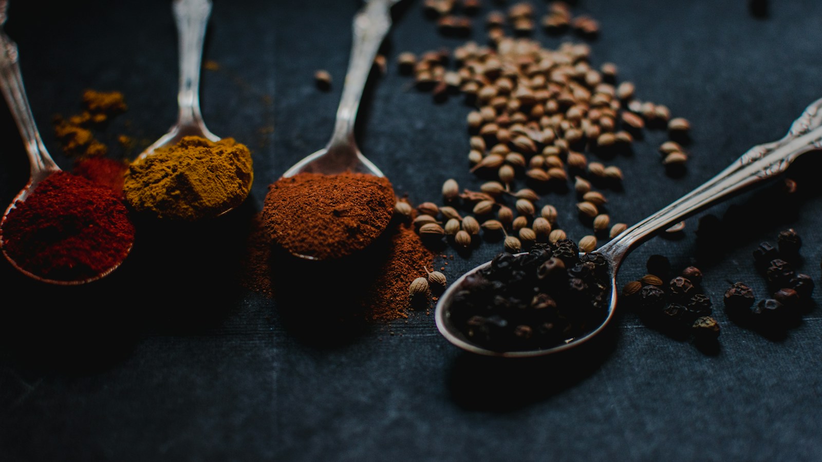 Indian spices in wooden bowls
